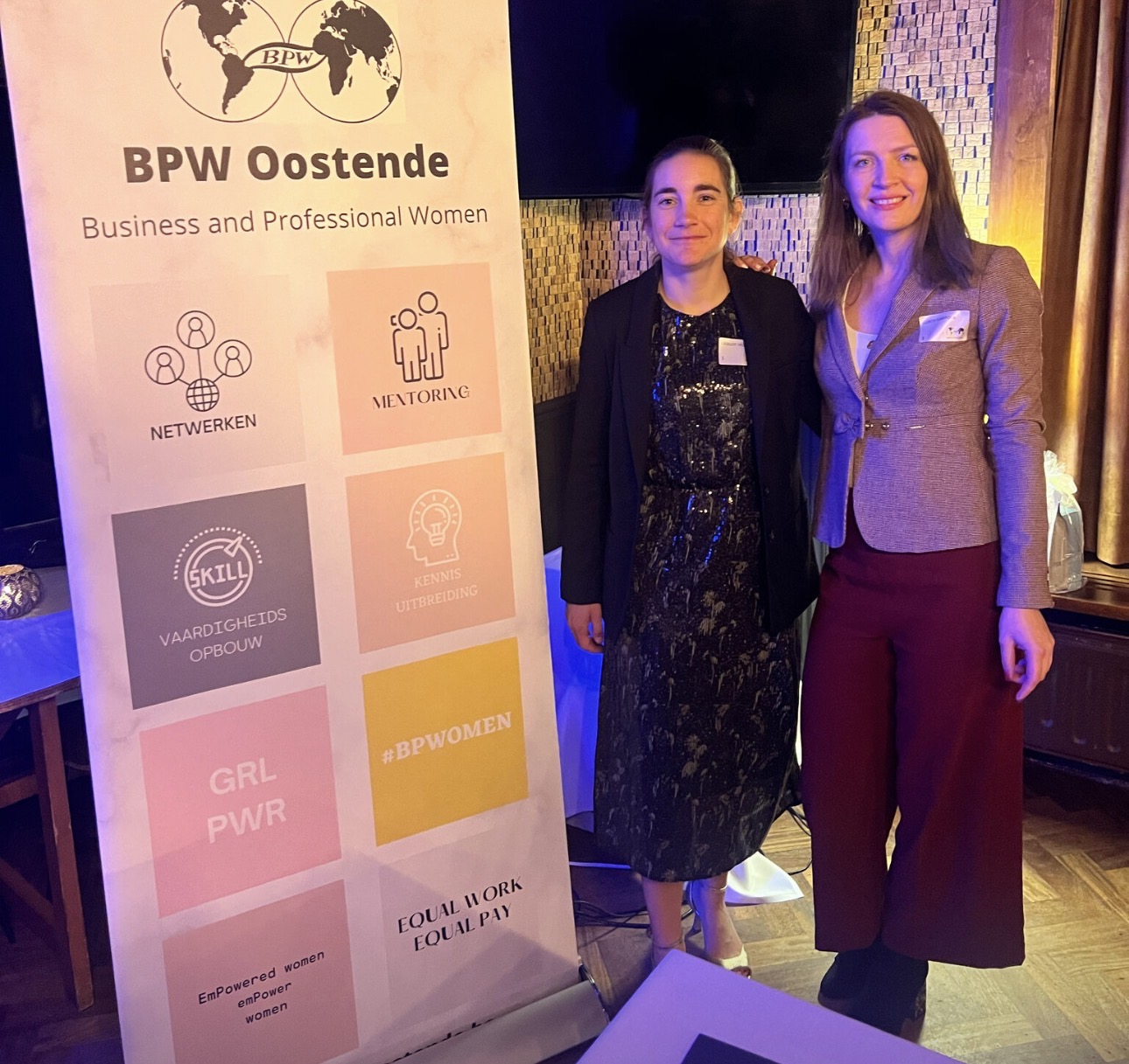 Luba Karpova beside a BPW Oostende Business and Professional Women banner.
